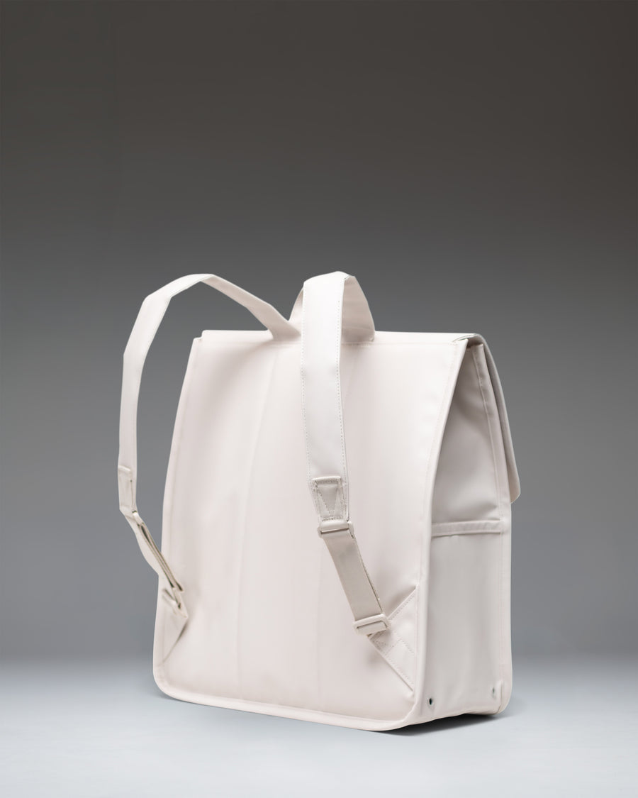 Herschel Supply Co. City Backpack in Moonbeam Tonal, featuring a minimalist rectangular design with a single strap magnetic closure.