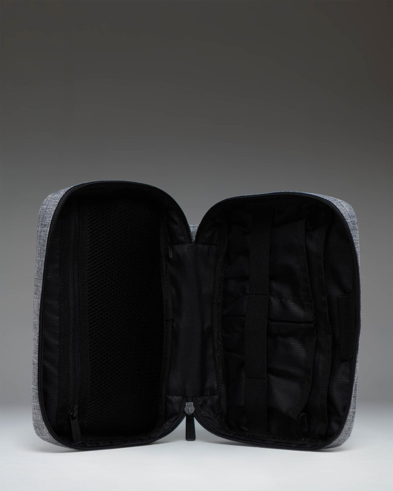 Herschel Supply Co. Burrard Organizer Tech in Raven Crosshatch, showing the open interior with organization pockets for cables and accessories.