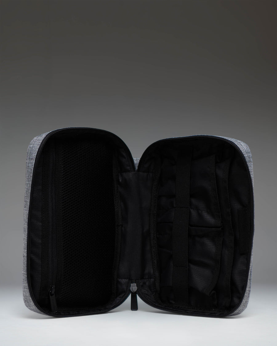 Herschel Supply Co. Burrard Organizer Tech in Raven Crosshatch, showing the open interior with organization pockets for cables and accessories.