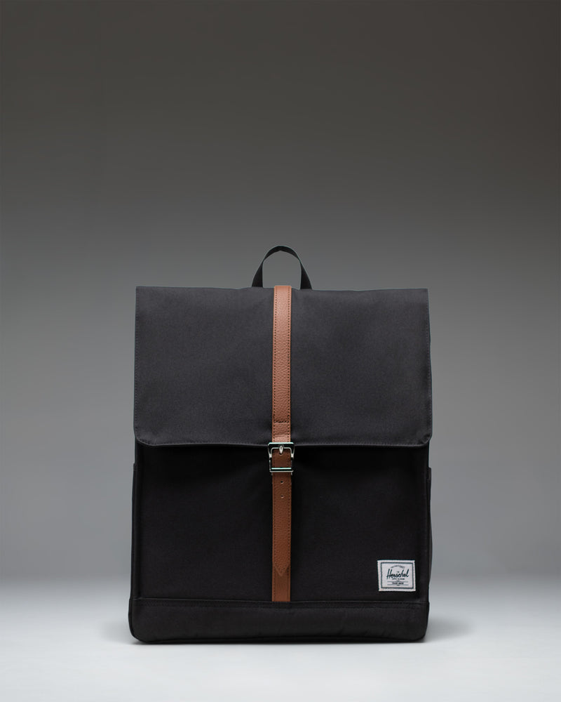 Herschel Supply Co. City Backpack in black, featuring a clean, minimalist design with a single strap closure and front storage sleeve.