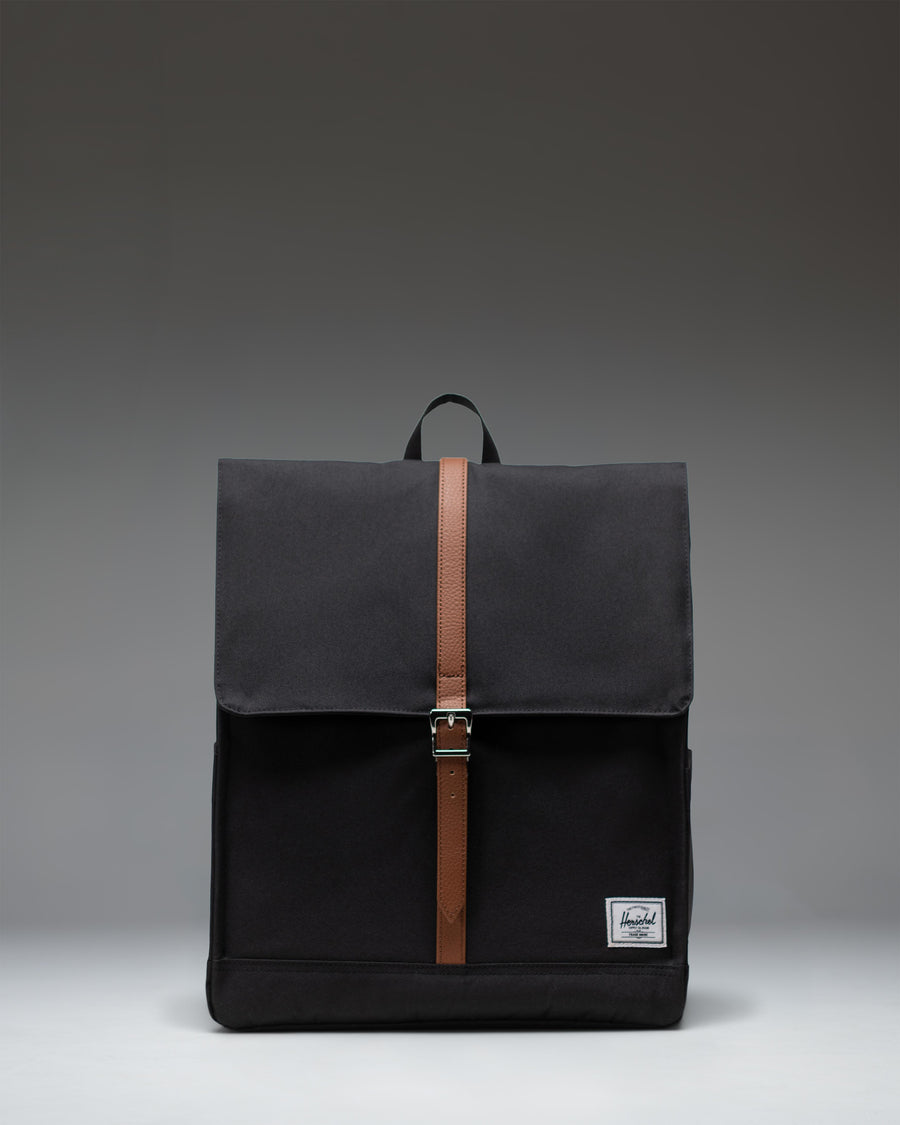 Herschel Supply Co. City Backpack in black, featuring a clean, minimalist design with a single strap closure and front storage sleeve.