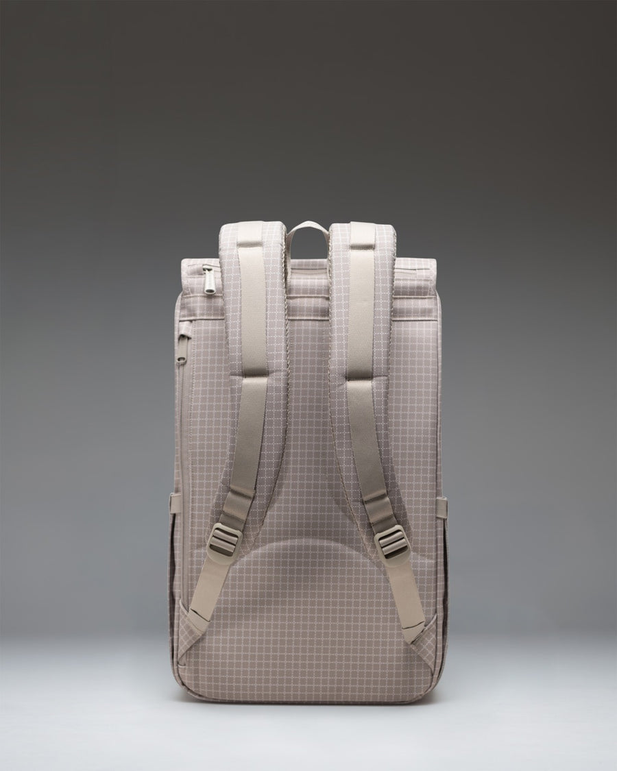 Herschel Little America Backpack in Grid London Fog, featuring a distinct grid pattern with dual rubber straps and a front storage pocket.