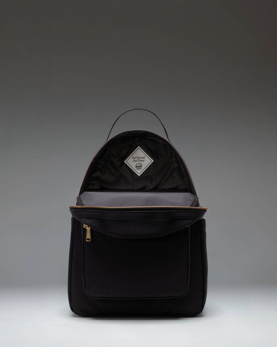 Black Herschel Supply Co. Nova Backpack with dual top carrying handles and front storage pocket.
