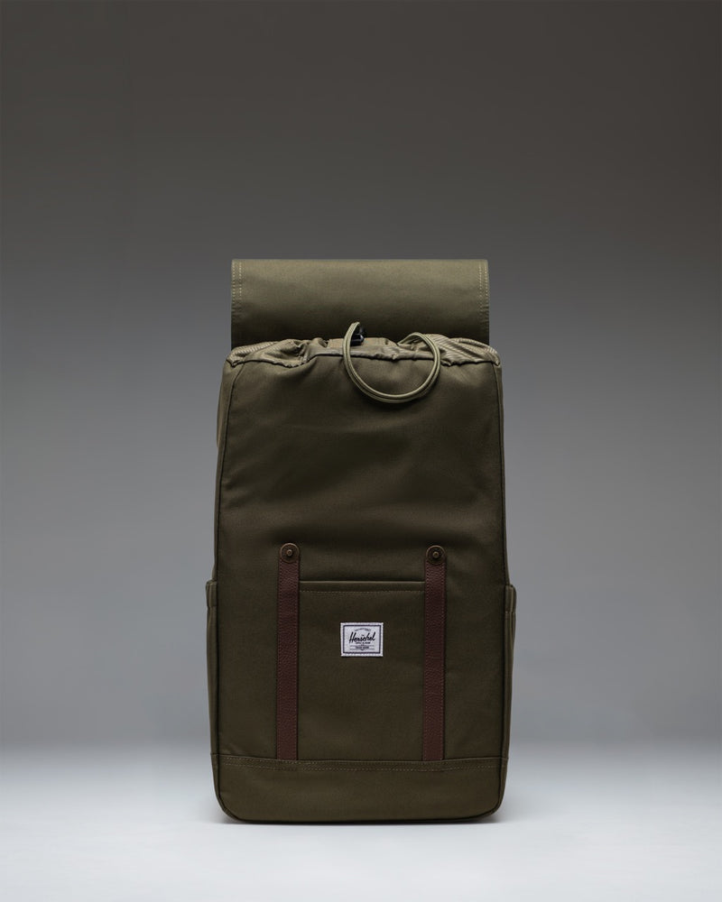 Herschel Retreat Backpack in Ivy Green, featuring a clean mountaineering-inspired design with magnetic strap closures.