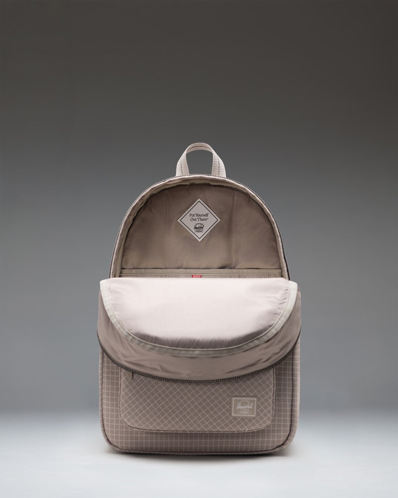 Herschel Supply Co. Settlement Backpack in the Grid - London Fog pattern, featuring a modern grid design in light grey tones.
