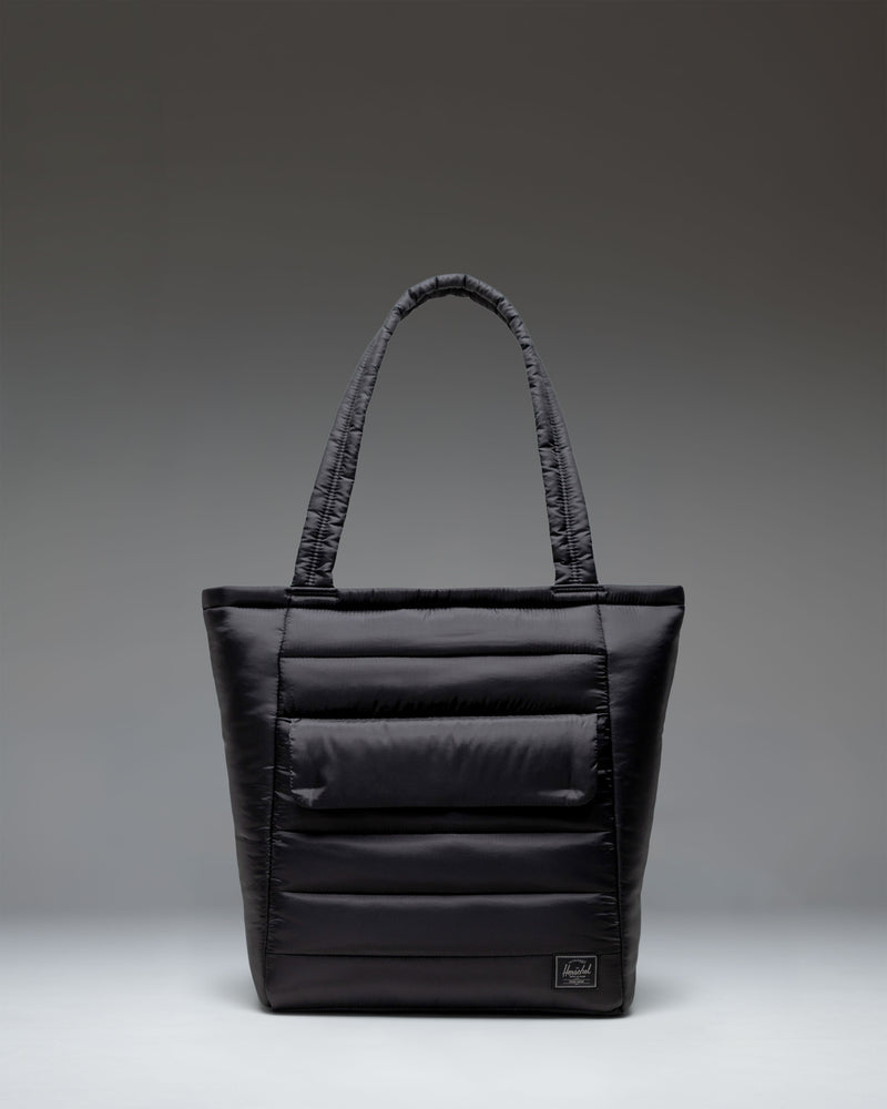Black Herschel Retreat Tote bag shown from the front against a white background.