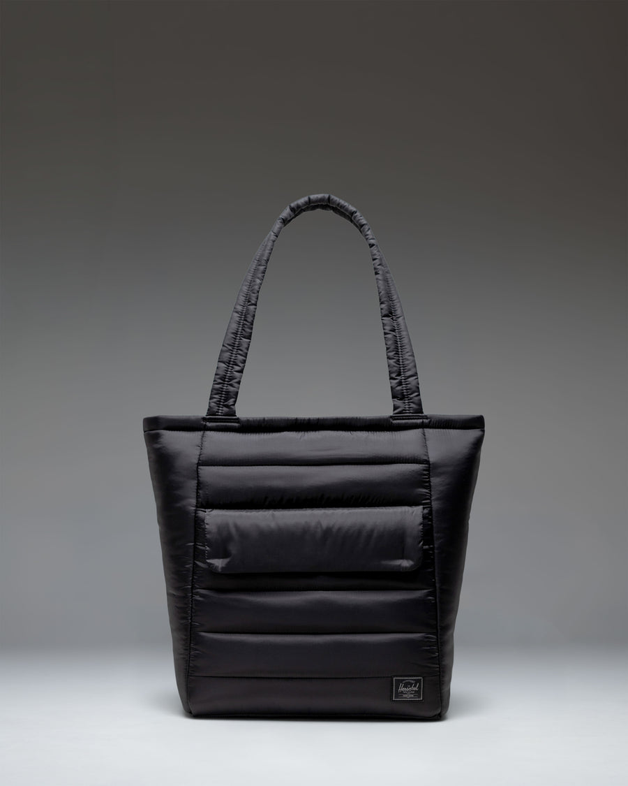 Black Herschel Retreat Tote bag shown from the front against a white background.