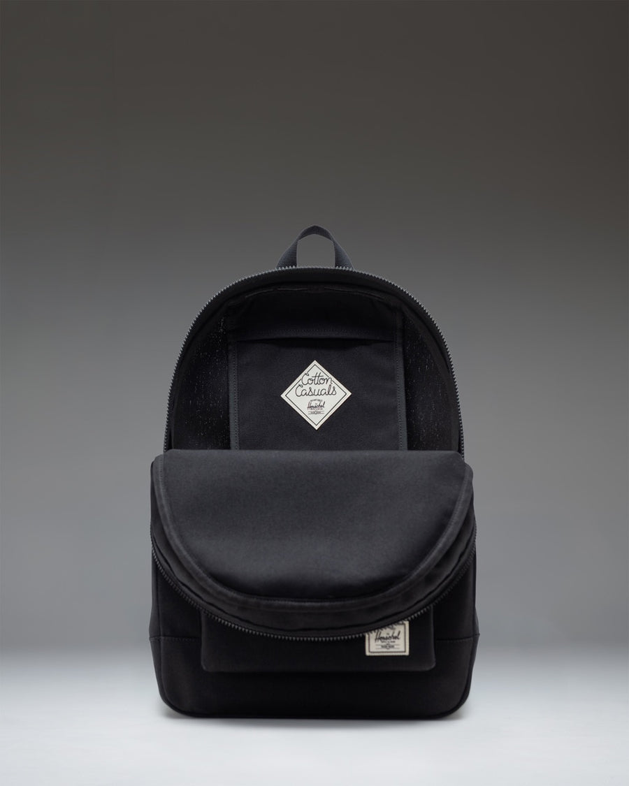 A classic Herschel Supply Co. Pacific Daypack in solid black, showcasing its clean design and durable fabric.