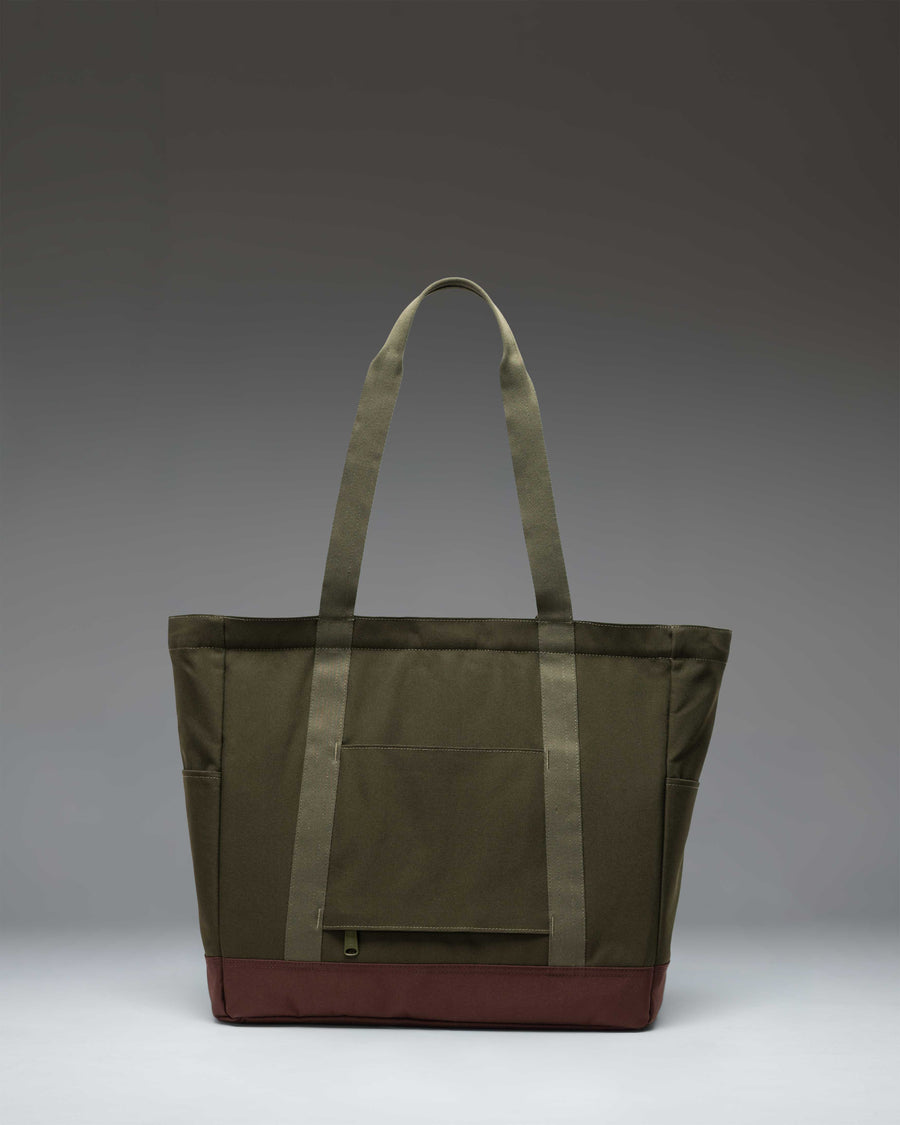 Herschel Heritage Tote in Ivy Green and Chicory Coffee brown, showing a front view of the canvas tote bag with a signature diamond detail.