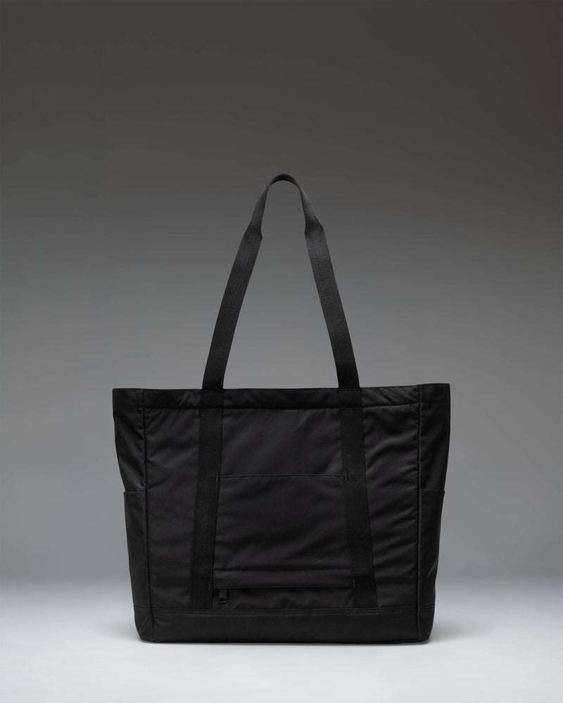 Herschel Heritage Tote bag in classic black recycled polyester construction featuring top-carrying handles and a front zip pocket with a key clip.