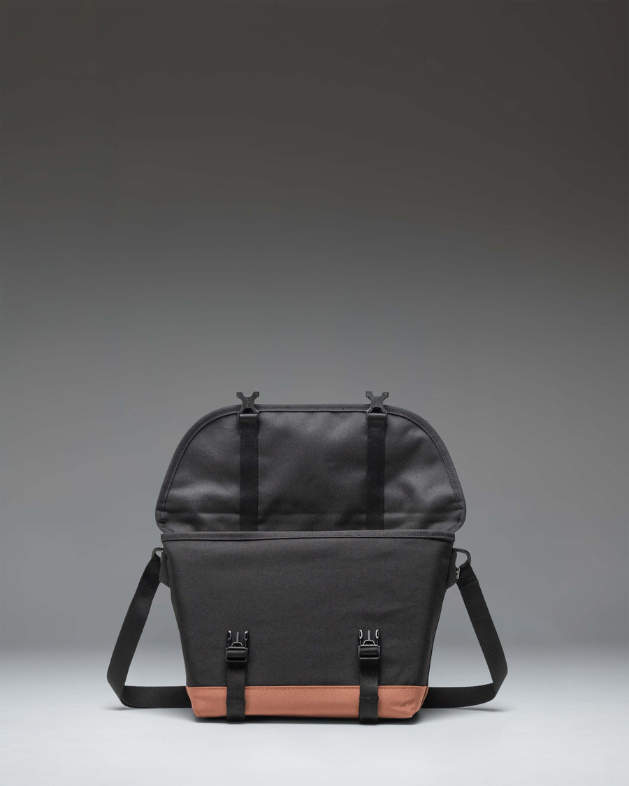 Herschel Supply Co. Cove Small Messenger bag in Black/Saddle Brown.
