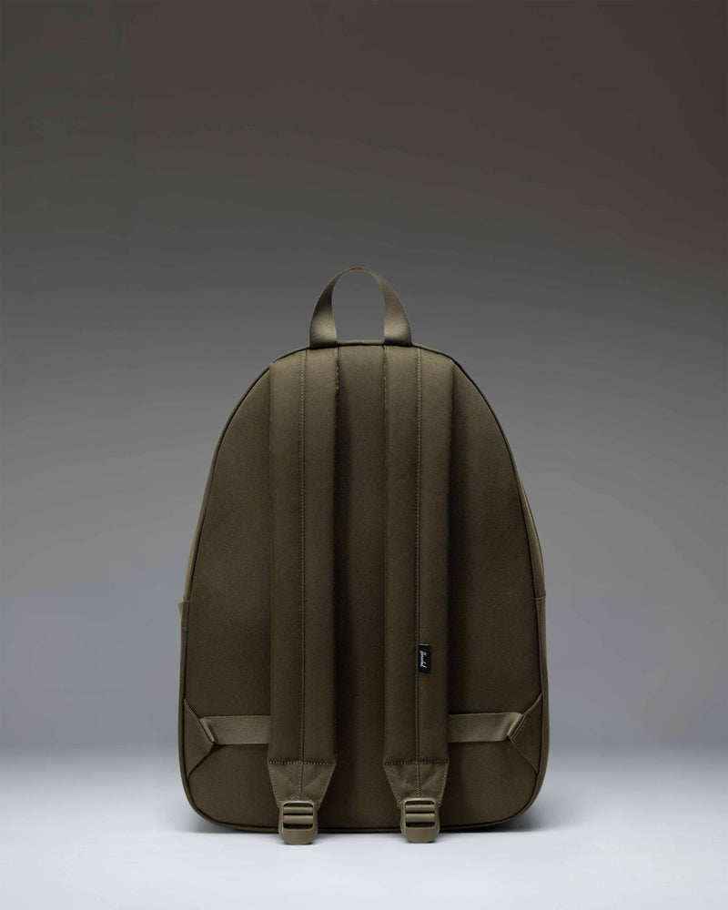 Herschel Classic Backpack in Ivy Green, showcasing its clean design, spacious main compartment, and front storage pocket.