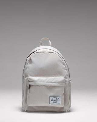 Herschel Classic Backpack in Moonbeam, a light beige everyday backpack shown from the front.