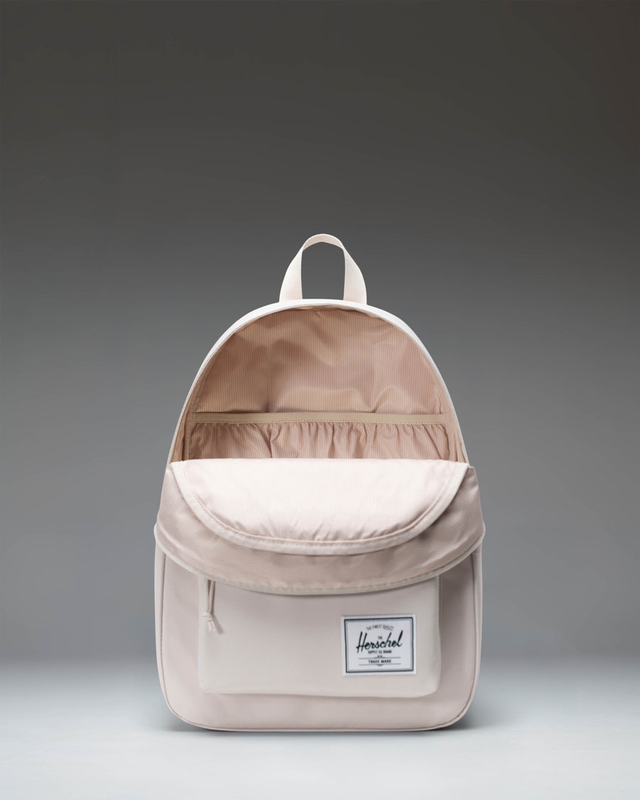 Herschel Classic Backpack size guide chart comparing Mini (6.5L), Standard (26L, 42.5x31.1x15.9 cm), and XL (30L) dimensions.