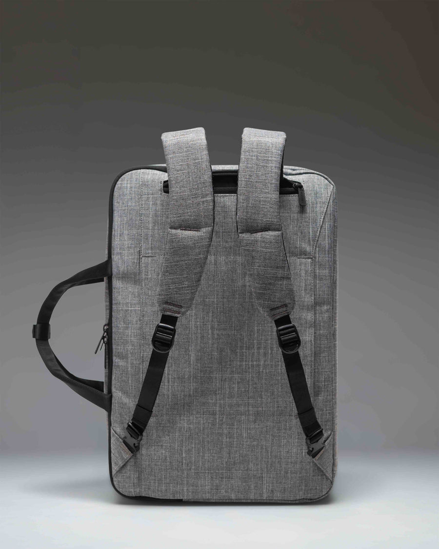 Herschel Supply Co. Bowen Convertible Travel Duffle Tech in Raven Crosshatch grey, showing the back panel and backpack straps.