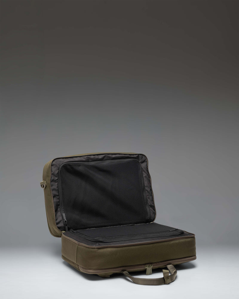 Herschel Supply Co. Bowen Convertible Travel Duffle Tech in Ivy Green Tonal showing the padded shoulder straps for backpack conversion.