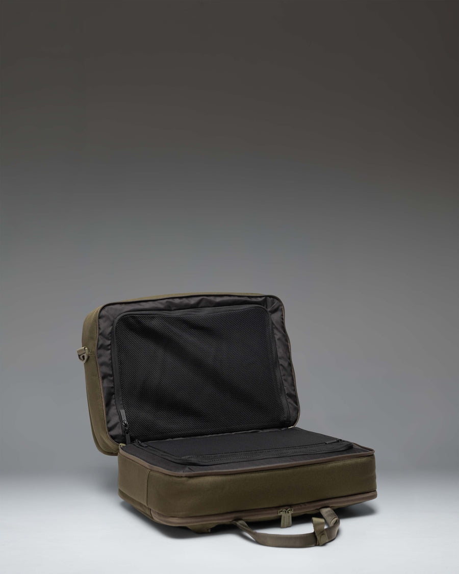 Herschel Supply Co. Bowen Convertible Travel Duffle Tech in Ivy Green Tonal showing the padded shoulder straps for backpack conversion.