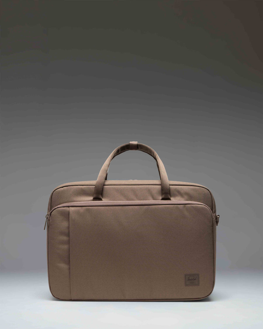 Herschel Supply Co. Bowen Convertible Travel Duffle Tech bag in light brown, shown from the front with backpack straps attached.