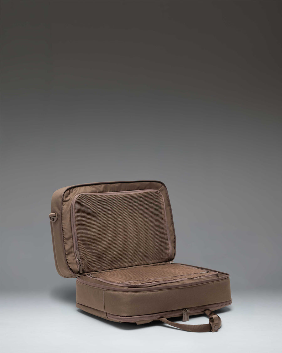 Herschel Supply Co. Bowen Convertible Travel Duffle Tech in light brown, an essential travel bag designed with functional compartments.
