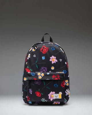 Herschel Supply Co. x LEGO Classic XL Backpack in Falling Florals print featuring a black background with vibrant, colorful LEGO brick flowers.