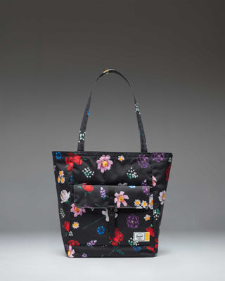 Herschel Supply Co. LEGO Retreat Tote bag in Falling Florals print featuring a black background with vibrant pink, yellow, and green flowers.