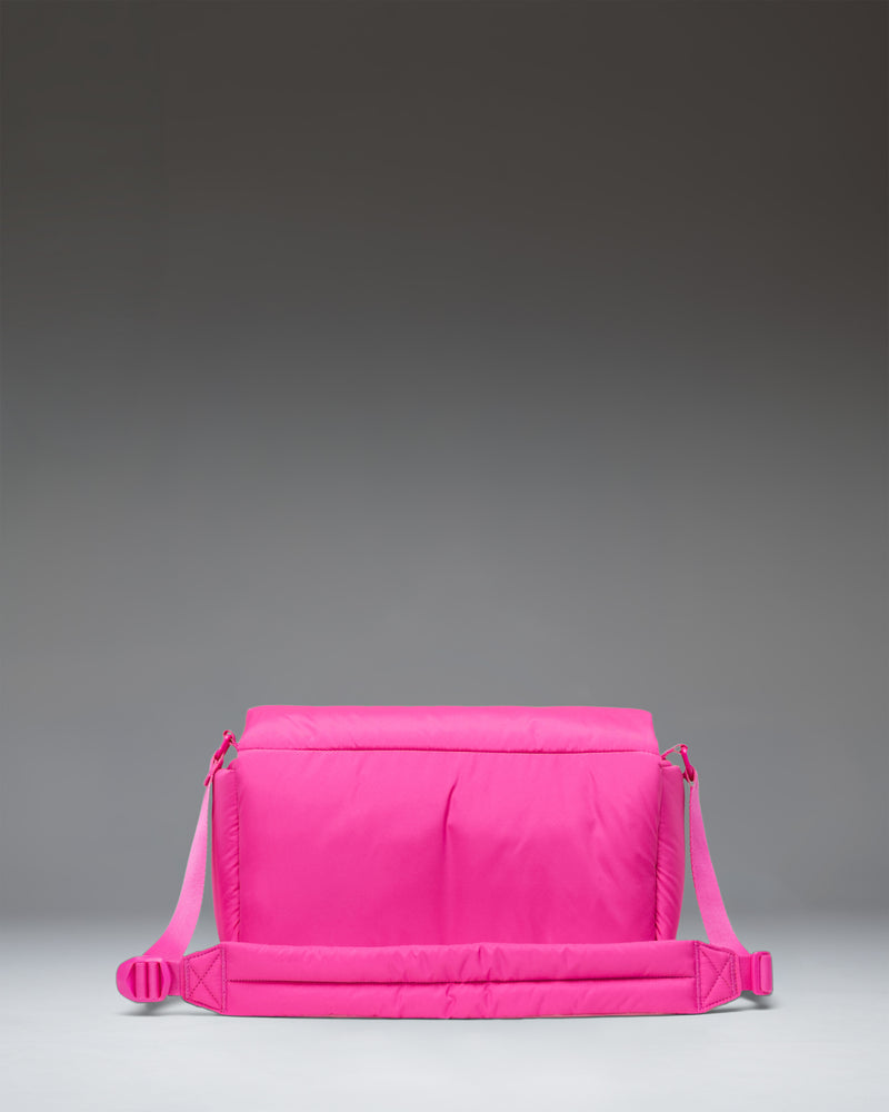 Herschel Cloudform Crossbody bag in Rose Violet, shown from the front with its adjustable strap.