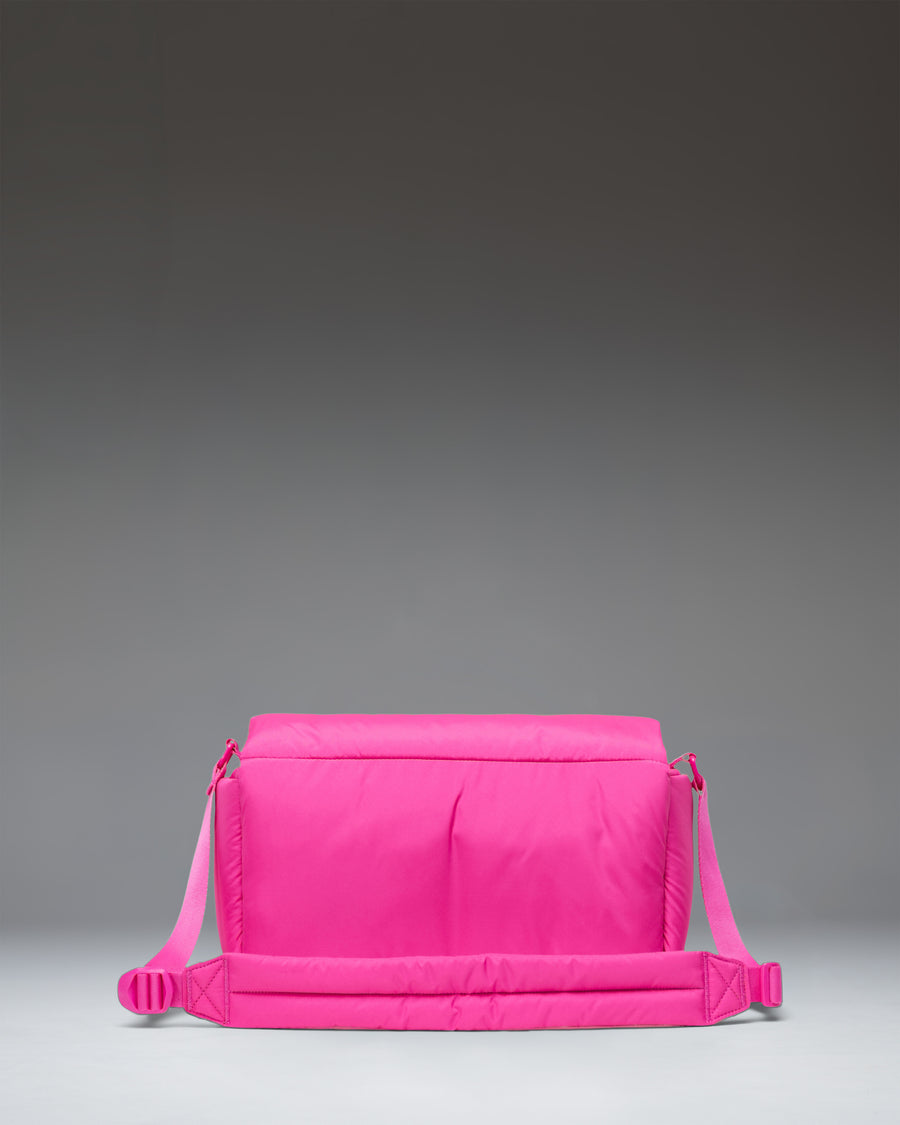 Herschel Cloudform Crossbody bag in Rose Violet, shown from the front with its adjustable strap.