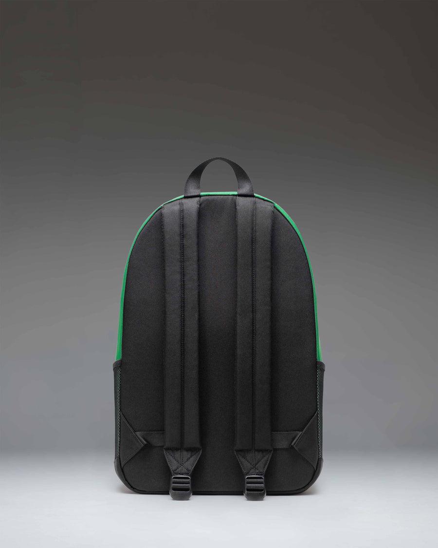 Herschel Supply Co. Kaine Backpack in Varsity Pine green, showing a detailed view of the front zippered pockets, key clip, and durable construction.