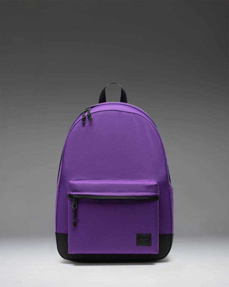 Herschel Classic XL Backpack in Acai purple color. Sleek design with a spacious main compartment and a front zippered pocket.