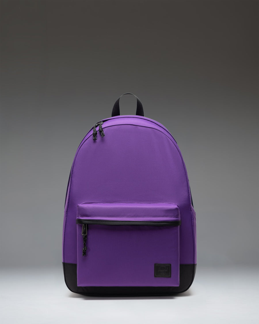 Herschel Classic XL Backpack in Acai purple color. Sleek design with a spacious main compartment and a front zippered pocket.