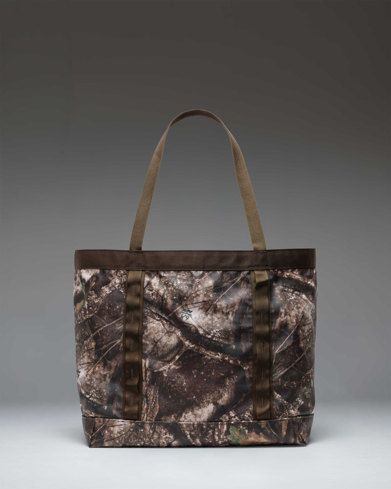 Herschel Supply Co. Realtree All Season Gear Tote 33L in Realtree APX Camo, displaying a detailed view of the large camouflage tote bag.