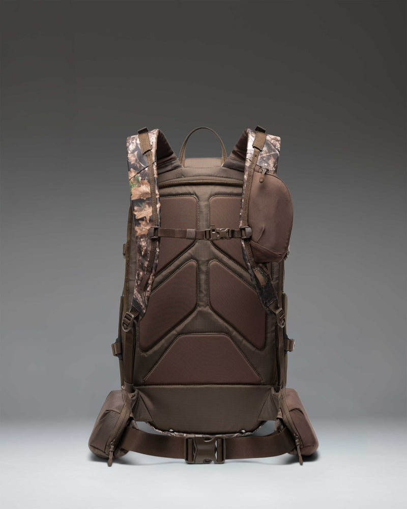 Herschel Supply Co. Realtree All Season Pro Backpack 36L in Realtree APX Camo pattern shown from a side view.