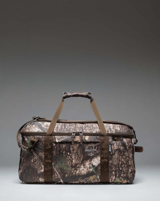 Herschel Supply Co. Realtree All Season Duffle 41L bag featuring the Realtree APX Camo pattern.