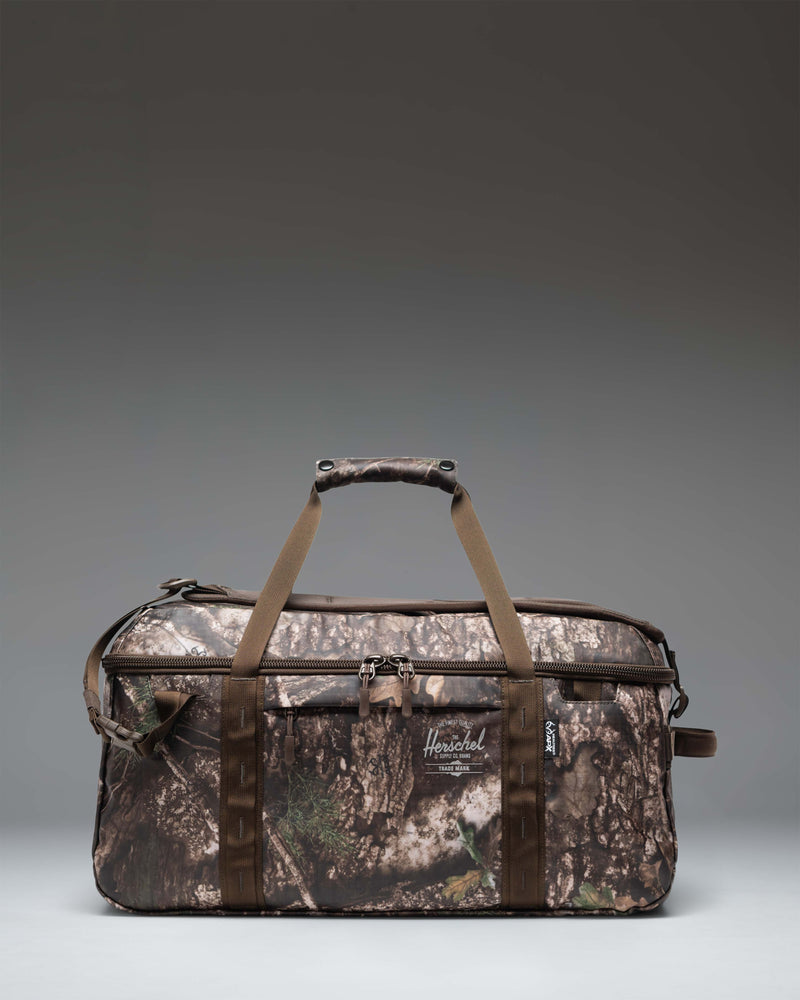 Herschel Supply Co. Realtree All Season Duffle 41L bag featuring the Realtree APX Camo pattern.