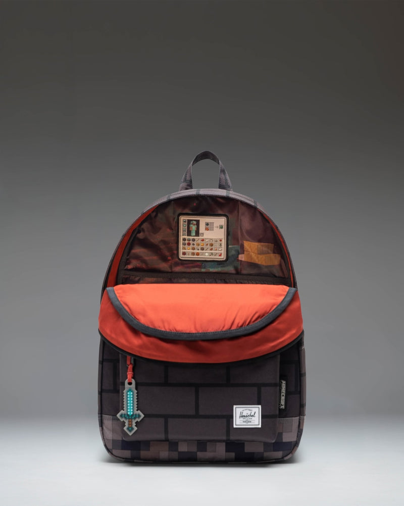 Minecraft Herschel Classic Backpack in The Nether color option, featuring a pixelated red and black pattern inspired by the video game.