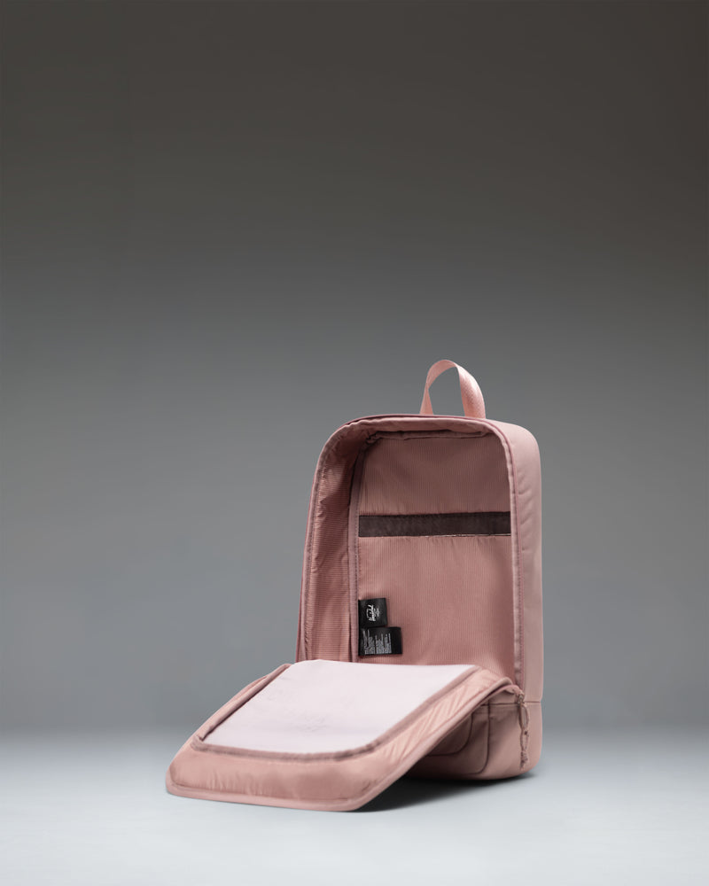 Herschel Supply Co Heritage Shoe Bag in Ash Rose pink, featuring a main zipper compartment, webbed carrying handle, and classic woven label.