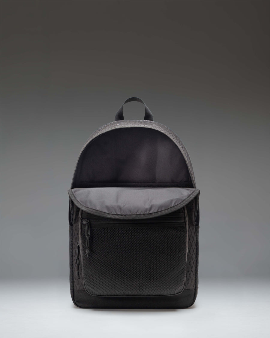 Herschel Supply Co. Kaine Backpack in Black Diamond/Black, featuring a spacious design with dual front pockets and mesh water bottle sleeves.