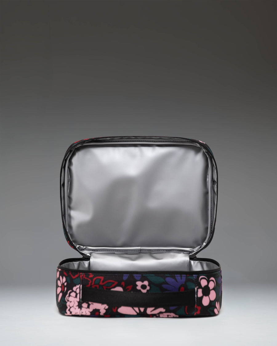 Herschel Supply Co. Pop Quiz Lunch Box in Moody Bloom, featuring a dark floral pattern.