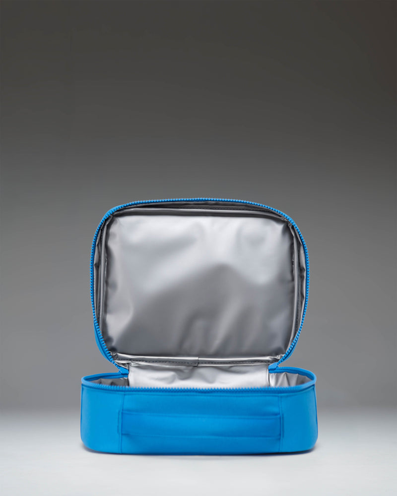 Herschel Supply Co. Pop Quiz Lunch Box Little Herschel in French Blue, featuring a front zipper pocket and a white brand label.