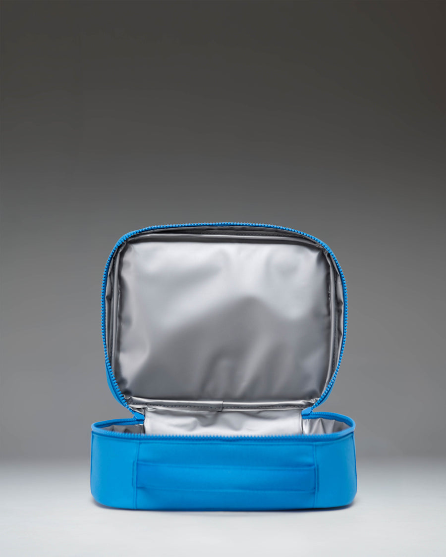 Herschel Supply Co. Pop Quiz Lunch Box Little Herschel in French Blue, featuring a front zipper pocket and a white brand label.