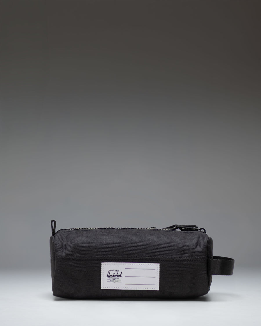 Black Herschel Supply Co. Settlement Pencil Case Little Herschel shown from an angled front view, featuring a classic zippered design.