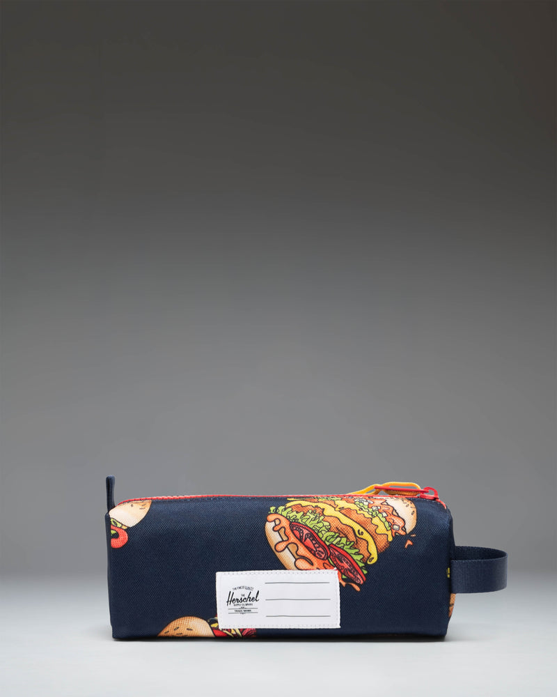 Herschel Supply Co Settlement Pencil Case Little Herschel in two-tone blue and coral pink, featuring a front storage sleeve and zipper closure.