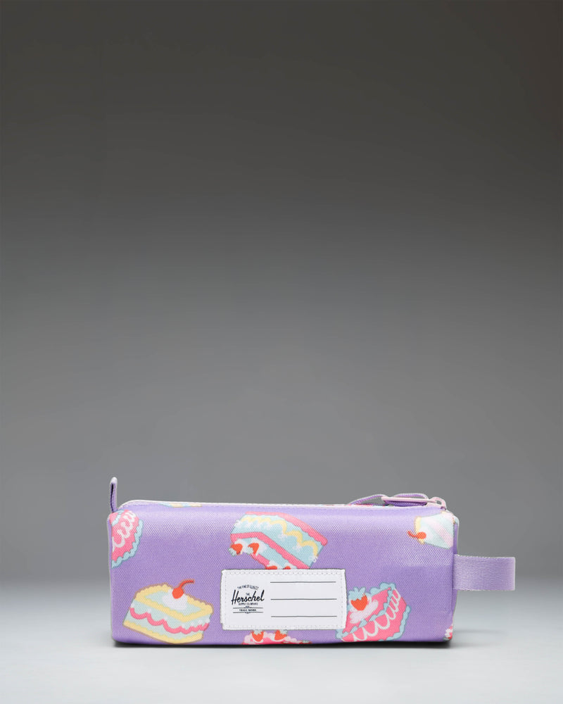 Herschel Supply Co. Settlement Pencil Case Little Herschel in Cakes, featuring a white background with a colorful pattern of frosted cakes and candles.