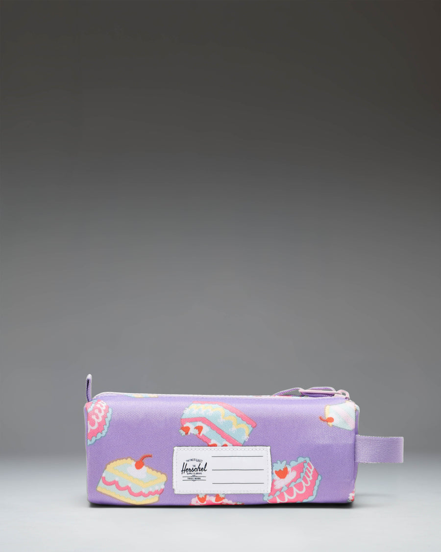 Herschel Supply Co. Settlement Pencil Case Little Herschel in Cakes, featuring a white background with a colorful pattern of frosted cakes and candles.