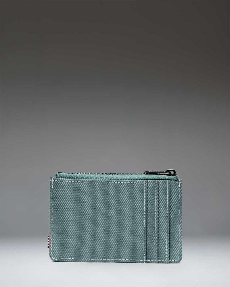 Black Oscar Cardholder wallet with a white Herschel logo tag sown at the front.
