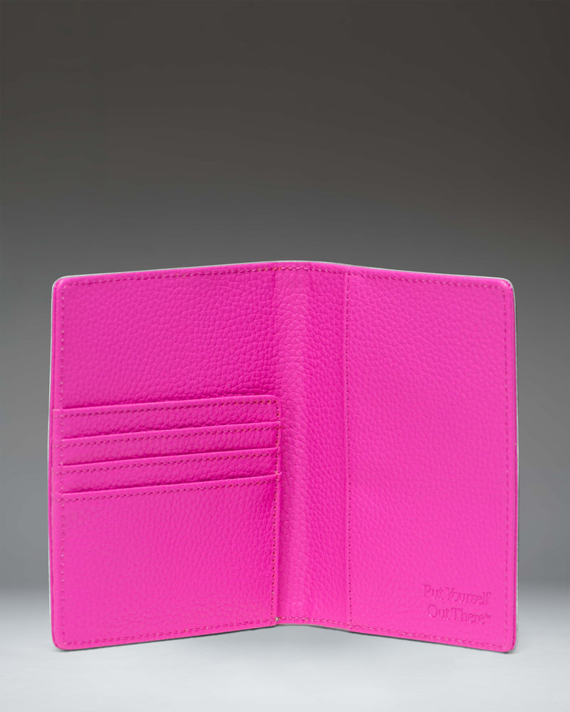 Herschel Supply Co Raynor Passport Holder Vegan Leather in Rose Violet, showing the interior pockets and passport slot.