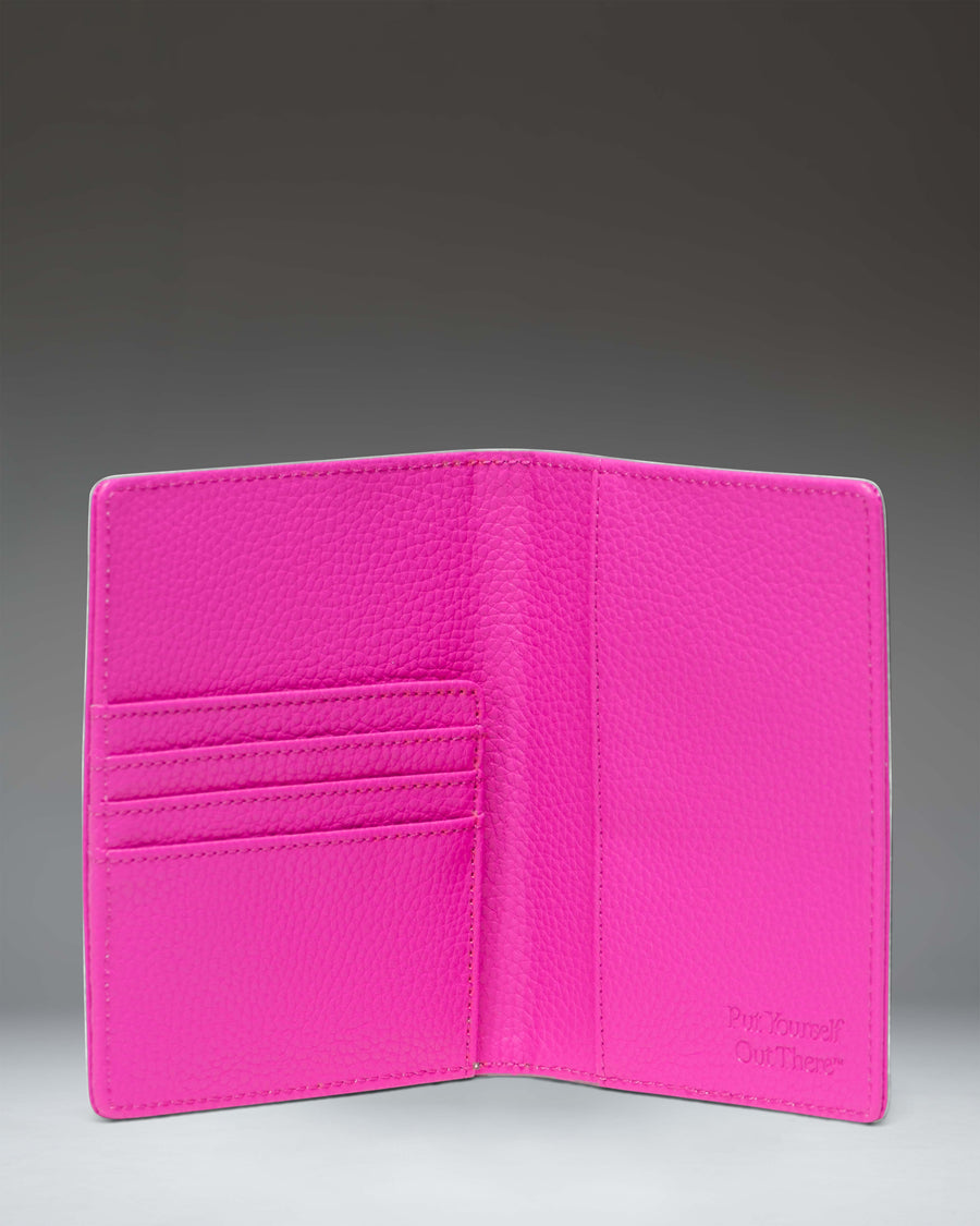 Herschel Supply Co Raynor Passport Holder Vegan Leather in Rose Violet, showing the interior pockets and passport slot.