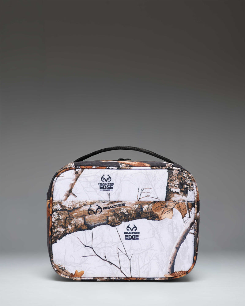 Herschel Supply Co. Realtree Pop Quiz Lunch Box in Realtree Edge Camo White/Black, showing the insulated interior and front zippered pocket.