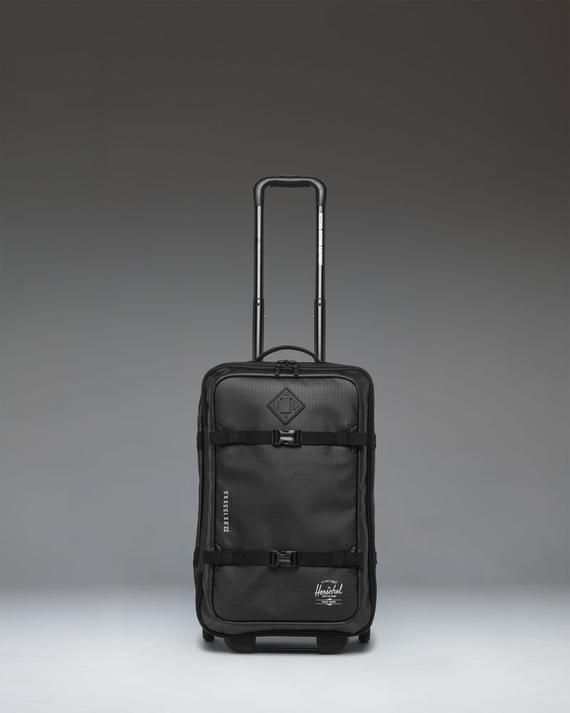 Herschel Supply Co. All Season Hybrid Roller Bag Large Carry On in black, showing the front exterior view of the luggage.