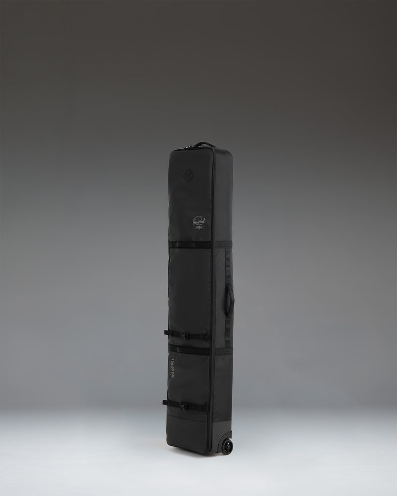 Black Herschel Supply Co Snow Roller Bag 158cm, durable travel bag for snowboarding gear.
